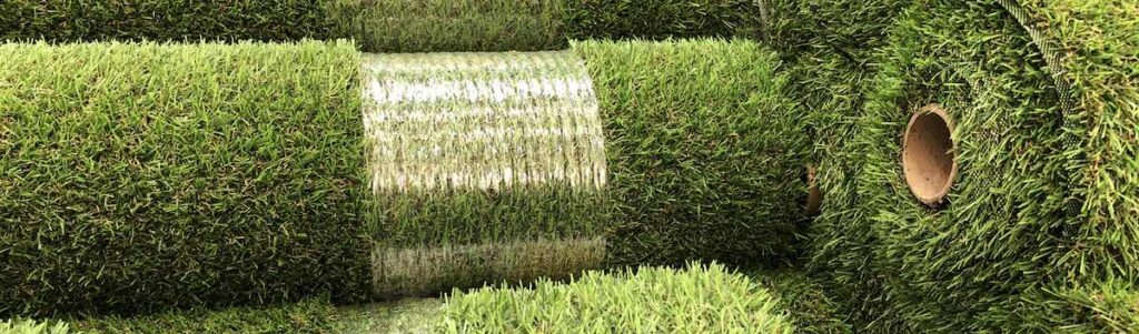 Rolls of new artificial grass in the shop